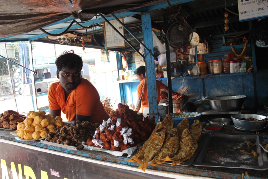 A roadside stall frying snacks fresh for the lunch stop