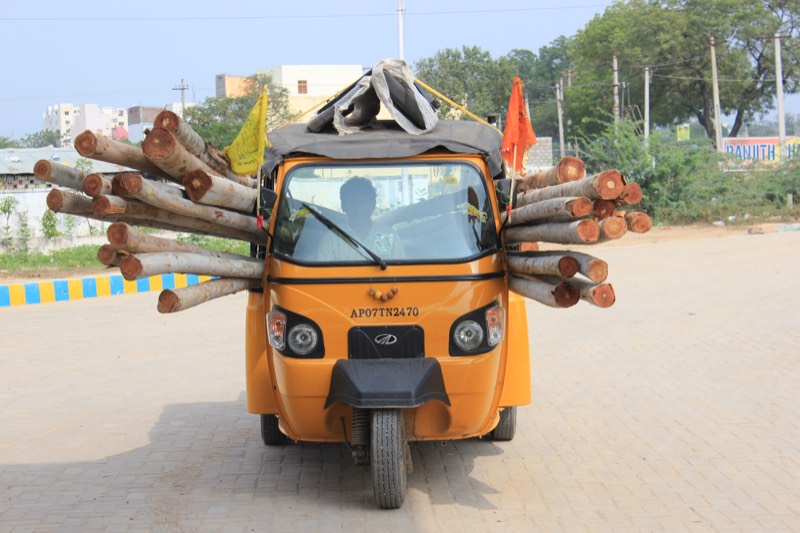 A heavily loaded autorickshaw on its way to market